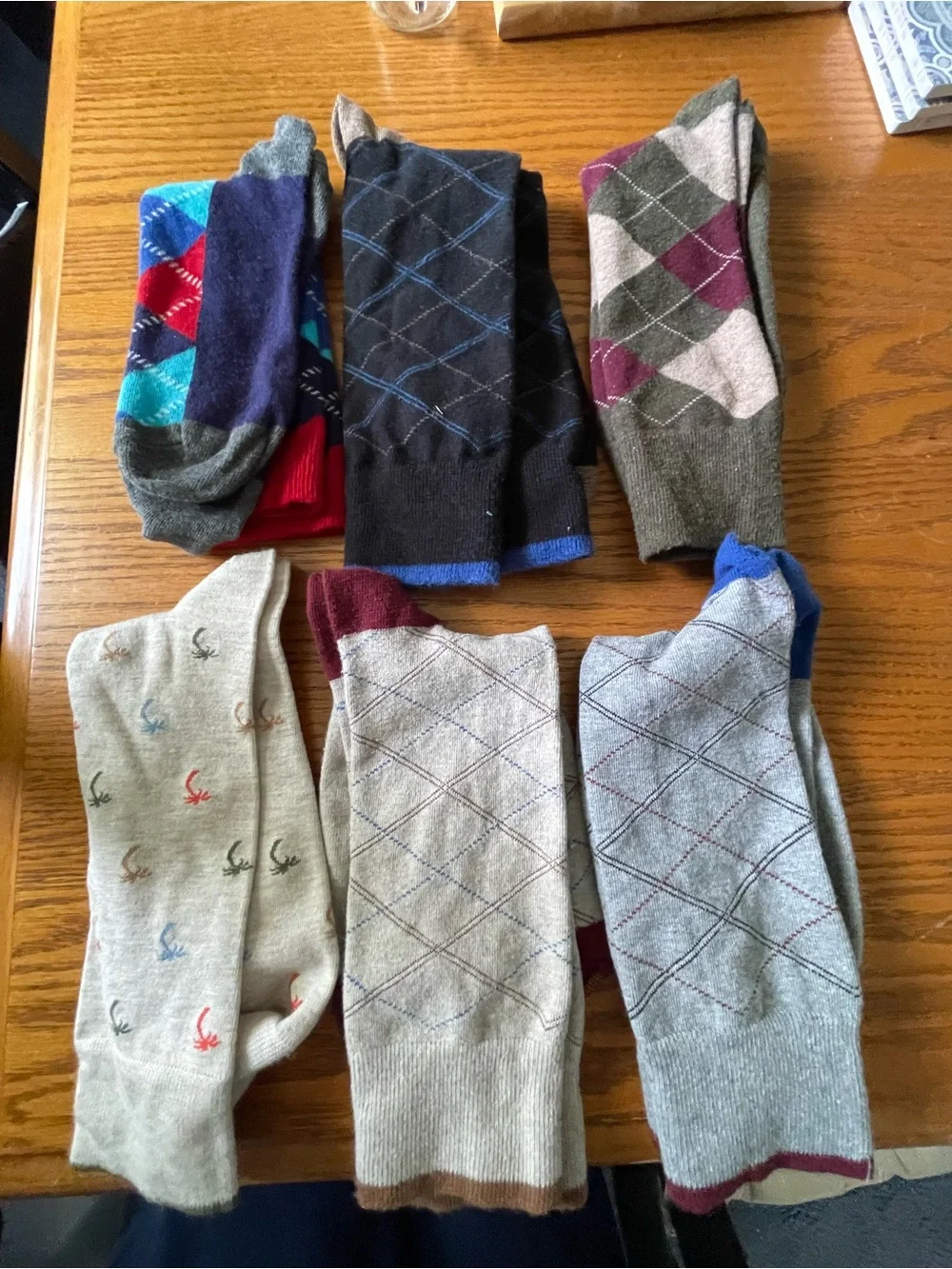 Six pairs socks, including some argyle & one tropical pattern